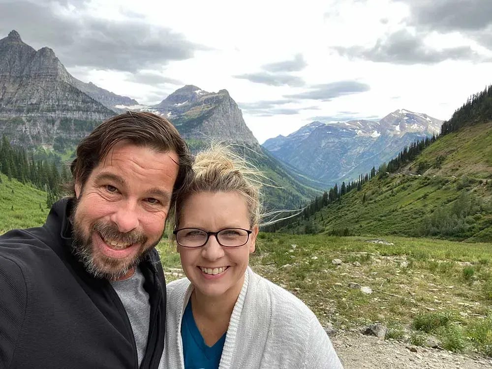 James and Donetta standing in front of the mountains at GNP.